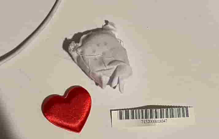 A Build-a-Bear heart, old soundbox, and the scrap of a tag